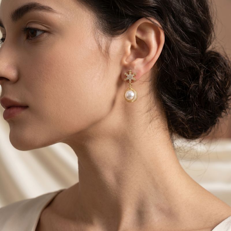 Prionori crystal snowflake earrings featuring elegant white pearl drop design